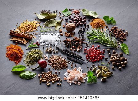 Spices and herbs on a black background