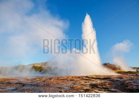 Great view of Strokkur geyser in morning light. Popular tourist attraction. Unusual and gorgeous scene. Location place Geyser Park, Hvita river, Haukadalur valley area, Iceland. Europe. Beauty world.