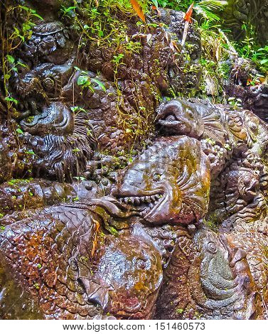 The rock bas-relief at rafting in the canyon on Balis mountain river Ayung at Indonesia