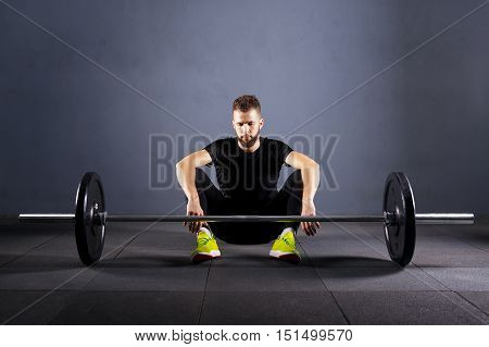 Athlete relax before barbells exercise at gym