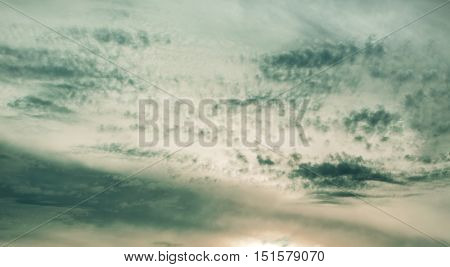 Background with gray beautiful overclocked windy clouds on sky