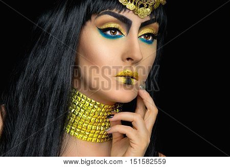 Cleopatra halloween makeup with a caucasian girl posing in the studio