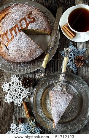 Homemade spiced Christmas sponge cake and crocheted snowflakes