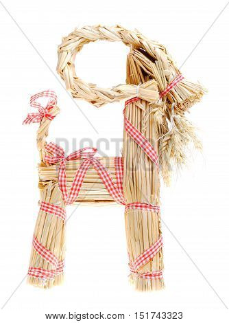 Traditional Swedish Christmas decoration with red and white ribbons a Christmas billy goat side view isolated on white background.