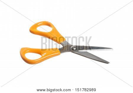 A pair of sissors in open position with orange handles isolated on white background.