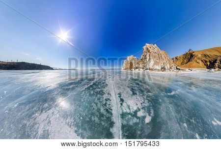 Wide-angle View Shaman Rock Or Cape Burhan On Olkhon Island In Winter, Surrounded By The Blue Ice Of