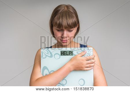 Frustrated Overweight Woman Holding Digital Scales With Help!
