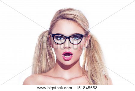 Sexy smart blonde wondering woman in glasses with double pigtails isolated on white