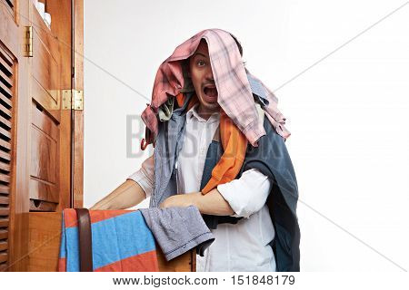 Man With Panic Next To Wardrope
