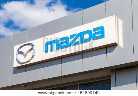 SAMARA RUSSIA - MAY 11 2016: Mazda logo on the facade of official dealer office. Mazda Motor Corporation is a Japanese car brand automotive manufacturer