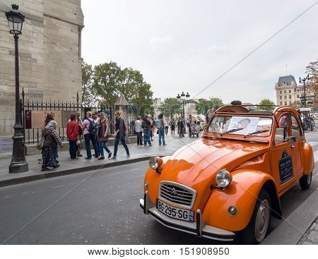 Old Citroen 2Cv Parked At Cathedral Notre-dame De Paris, France.