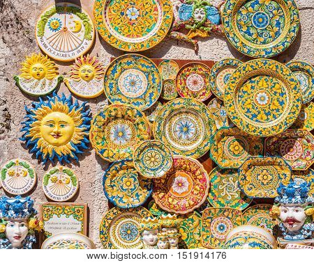 ERICE ITALY - SEPTEMBER 12 2015: Traditional souvenirs of ceramics and Trinacria is symbol of Sicily Italy.