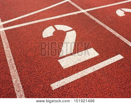 Number Two. Big White Track Number On Red Rubber Racetrack.