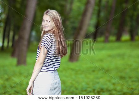 Teenagers Lifestyle Concepts. Portrait of Smiling Blond Caucasian Teenager Posing Outdors.Horizontal Image Composition