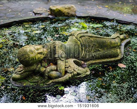 sleeping thai lady statue at Suan Nai Dum Chumphon Thailand