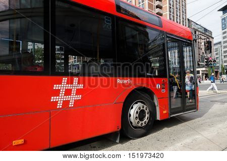 Oslo, Norway - September 16, 2016: Side view of a public transport city bus in trafic for Ruter in downtown Oslo.