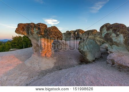 The first rays of the sun over  The Stone Mushrooms near Beli plast village, Kardzhali Region, Bulgaria