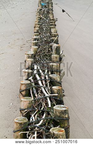 Breakwaters Protrude Into The Wadden Sea At Low Tide Near Nordstrand, Schleswig-holstein, Germany