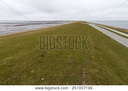 Empty Dike With Cloudy Sky Near Nordstrand, Schleswig-holstein, Germany