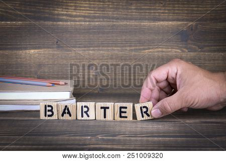 Barter Concept. Wooden Letters On The Office Desk, Informative And Communication Background