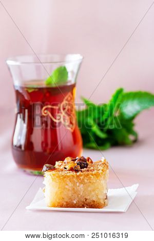 Basbousa Or Namoora Traditional Arabic Dessert And Mint Tea. Delicious Homemade Semolina Cake. Copy 