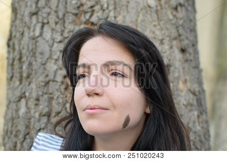 Beautiful Girl With Dark Hair And Different Eye Color Heterochromia . Smiles At The Photos In The Pa