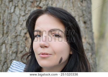 Beautiful Girl With Dark Hair And Different Eye Color Heterochromia . Smiles At The Photos In The Pa