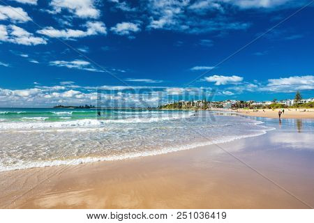 MOOLOOLABA, AUSTRALIA, JUL 22 2018: People enjoying summer at the Mooloolaba beach - a famous tourist destination in Queensland, Australia.