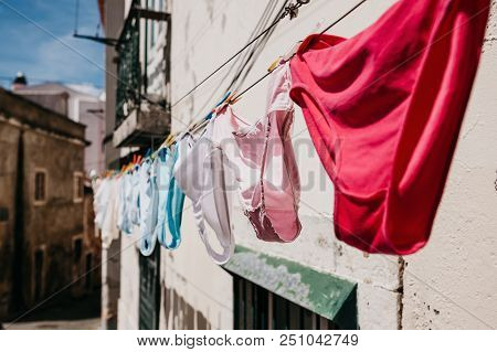 Authentic Photography. Close-up Panties Dry On The Street In Lisbon In Portugal. The National Peculi