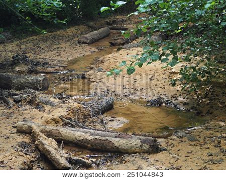 Rustrel, France - July 14, 2018: Photography Showing A Small Water Stream. The Photography Was Taken