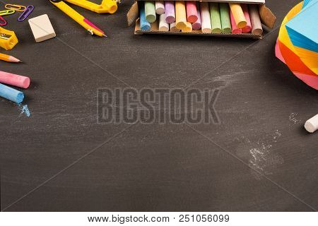Bright Office Supplies On Black Chalkboard Top View, Copy Space. Concept: Back To School, School's O