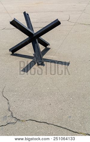 Anti-tank Barrage From Rails On Cracked Old Asphalt. Against War And Violence. Copy Space.