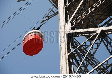 BARCELONA, SPAIN - APRIL 19, 2018: A vintage red cable car on the Transbordador Aeri del Port docks at the Torre de San Sebastia station. The attraction first opened in 1929.