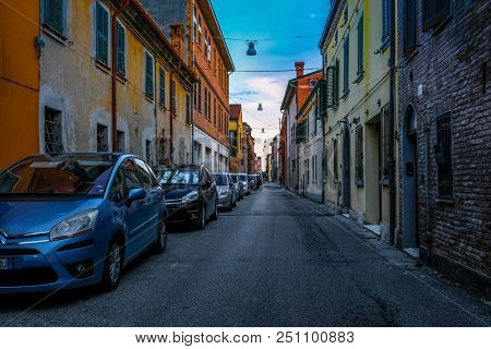 Ferrara, Italy - July, 23, 2018: cars parked in Ferrara, Italy, in evening