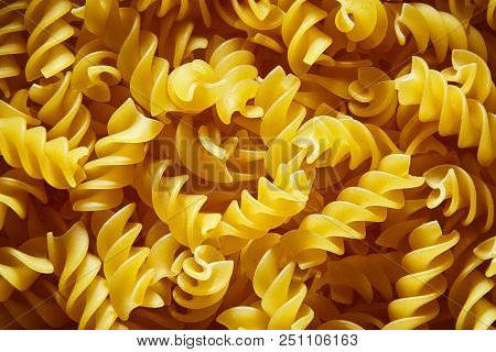 Raw Uncooked Dry Italian Fusilli Pasta. Corkscrew Spiral Shape