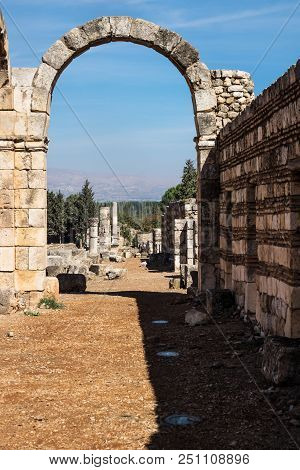 Arch In Umayyad City Ruins In Anjar With Mountains, Bekaa Valley, Lebanon