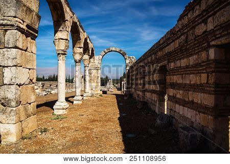 Archway In Umayyad City Ruins In Anjar With Mountains, Bekaa Valley, Lebanon