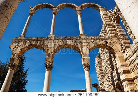 Arches At The Ruins Of Umayyad From Low Angle View In Anjar With Blue Sky , Bekaa Valley, Lebanon