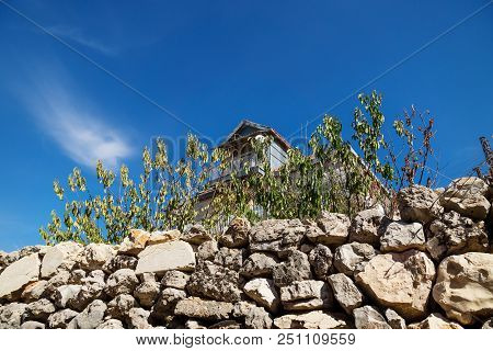 Traditional Lebanese House With Green Dry Fence With Blue Sky In Rachaiya, Bekaa Valley, Lebanon