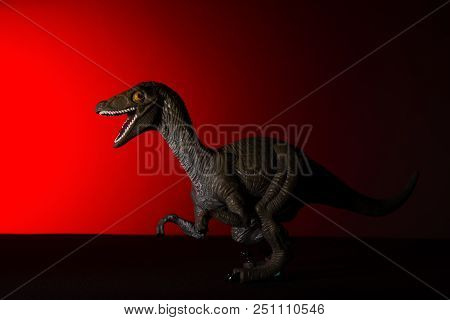 Deinonychus  With Spot Light On The Head And Red Light On Background No Logo And No Trademark