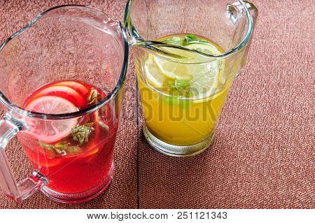 Yellow And Red Summer Lemonade On The Table..fresh Beverages.