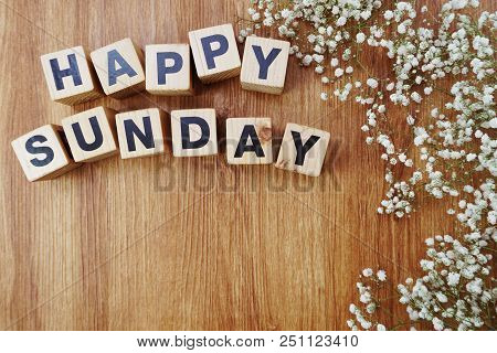 Happy Sunday Alphabet Letters On Wooden Background