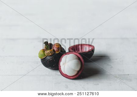 Natural Mangosteen On White Wood Natural Mangosteen On White Wood