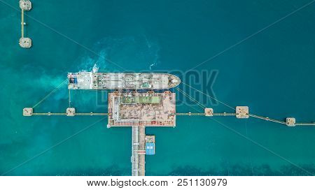Aerial Top View Of Oil Tanker Ship At The Port, Aerial View Oil Terminal Is Industrial Facility For 