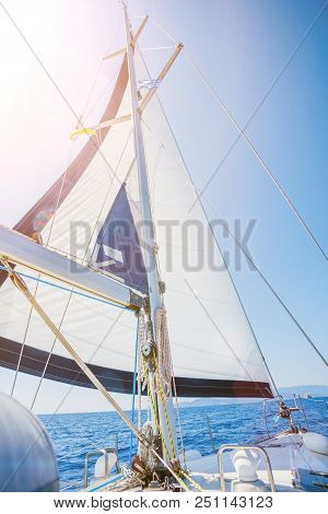 White Sails Of A Sailing Yacht In The Wind
