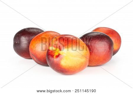 Group Of Five Whole Ripe Deep Red Nectarine Like Triangle Isolated On White