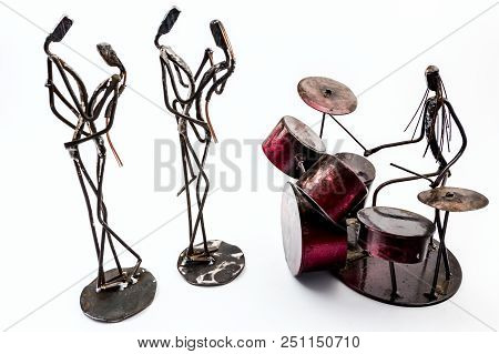 Figure Of Music Performer Made With Welded Black Metal Wire, Drummer Is Playing Solo And Two Couples