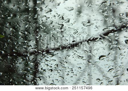 Raindrops On A Window Glass In A Gray Weather