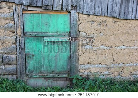Locked Green Wooden Door In Country House