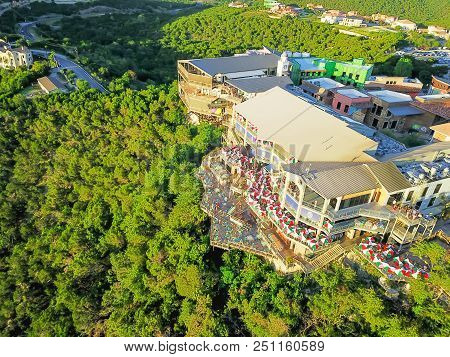 Top View Colorful Restaurant Near Cliff Rock Wall In Austin, Texas, Usa